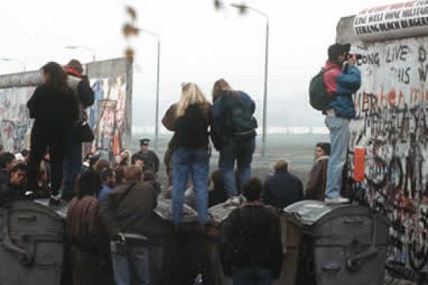 Berlin wall coming down image