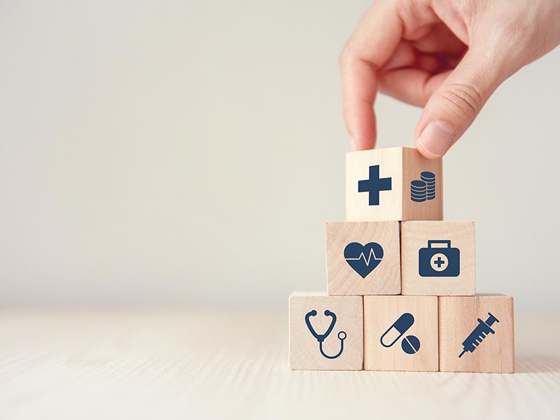 stacking blocks with healthcare icons on them